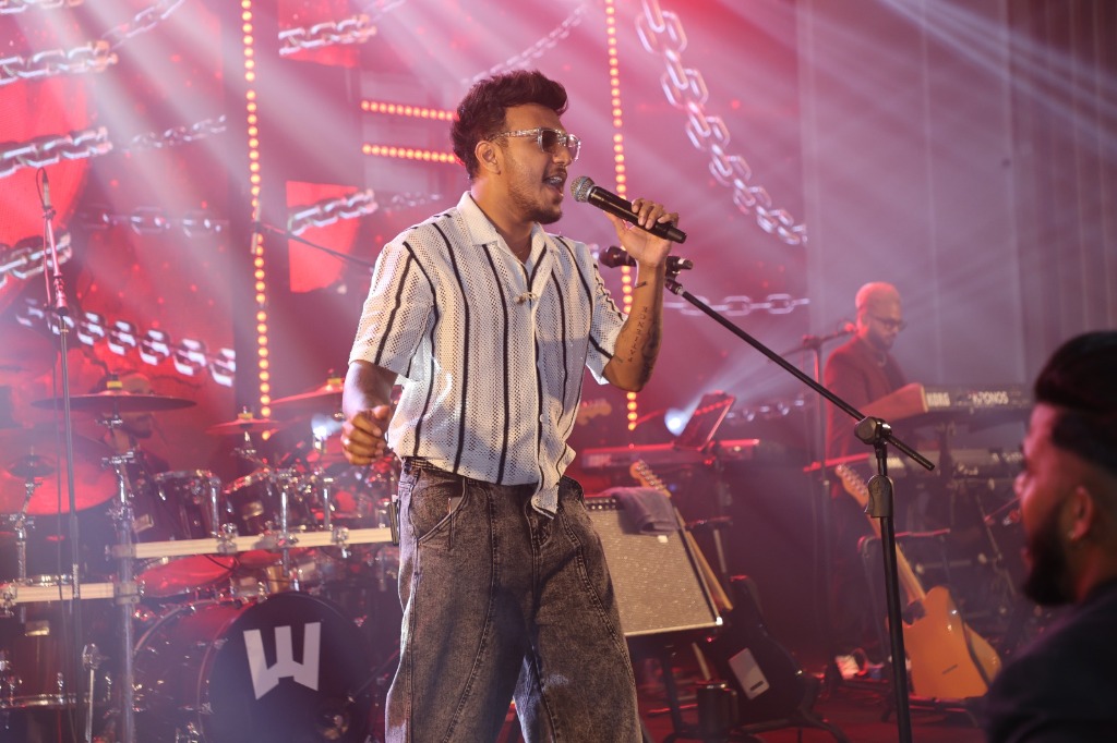 Close-up Vocalist Concert Performance under Red Stage Lights