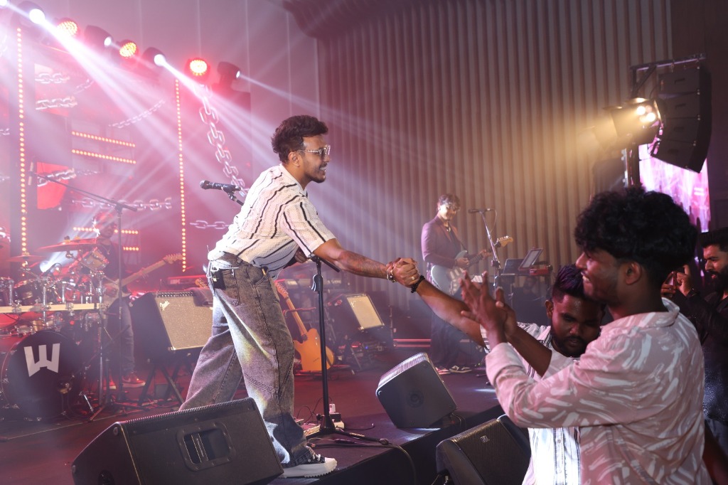 Vocalist Santhush Weeraman Shaking Hands with Fans in the Audience